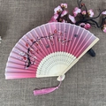 Pink gradient silk folding fan with bamboo frame featuring plum blossoms and tassels - No.65 Pink Gradient Plum Hollow