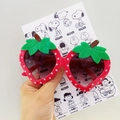 Cartoon strawberry-shaped sunglasses with red polka dot frames and green leaf accents - Rose Red