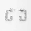 Macro view of C-shaped rectangular silver steel earrings with unique bamboo texture detail - Bamboo Texture/Rectangular / Silver