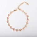 Macro shot of 18k gold plated heart bracelet featuring pink enamel charms and adjustable clasp - 17+5cm / Pink