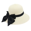 Detailed close-up of woven straw texture with elegant black satin ribbon bow on hat - Cream