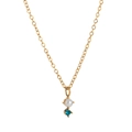 Detail of gold necklace featuring white pearl and blue gemstone on an elegant O-chain - December Necklace