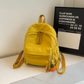 Mustard yellow corduroy mini backpack with adjustable straps and carrot charm pendant - With Pendant / Yellow