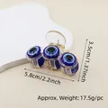 Detail view of the evil eye hair claw clip with dimensions 5.8cm length and 17.5g weight - 6cm 3-Round Eye Claw Clip