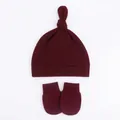 Detail view of wine red knotted baby beanie and anti-scratch mittens set in soft cotton - Wine Red Hat