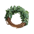 Close-up of Christmas napkin ring featuring green faux leaves and natural wood vine details - 6cm Green Vine Ring