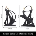 Modern abstract dancing couple figurines in matte black and gold finish resin - Golden Dance Set