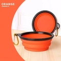 Collapsible orange TPE travel bowl for dogs with black rim and a metal carabiner clip - Orange