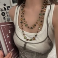 Bohemian double-layered necklace with green and brown shell beads on a model - Shell Necklace