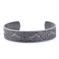 Close-up of Celtic dragon relief patterns on a vintage steel open cuff bracelet - Vintage Color (Double Dragon Bangle) (AB0703)
