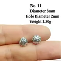 Macro detail of 8mm vintage alloy lantern beads with embossed floral pattern for DIY jewelry - 11# (Diameter 8mm Hole 2mm)