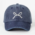 Navy blue washed cotton baseball cap with white embroidered bow on a white background - One Size / Navy Blue
