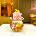 Macro shot of liquid sand bottle with cartoon pig wearing lemon hat and pink glitter fill - Without Buckle Style / Gold