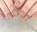 Detail of oval champagne cat-eye press-on nails with fine gold metallic French tips - Champagne Cat Eye Gold French Tip (CW17)
