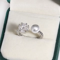Detail of silver clover ring with zircon stones and a pearl on a twisted rope band - Four-Leaf Clover Twisted Rope Artificial Pearl (White Gold Tone)