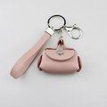 Detail of pink PU leather mini bag keychain with wrist strap and metal clasp - Lotus Pink