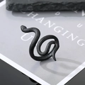 Macro detail of gothic black snake ring with matte finish on decorative stone base - Adjustable Open / Curved Snake