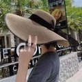 Elegant wide-brim straw sun hat in light brown with a decorative black silk ribbon bow - M (56-58cm) / Khaki With Black Bowknot