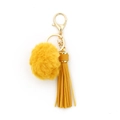 Chic keychain with yellow faux fur pom pom, matching leather tassel, and gold hardware - Turmeric