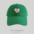 Forest green cotton baseball cap featuring colorful heart embroidery for women - Grass Green