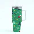 Close-up of green 40oz Christmas tumbler with handle and festive tree patterns - Style 1