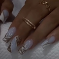 Macro detail of French style square press-on nails with gold leaf and silver glitter - Icy Transparent White Marble