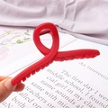 Red matte Morandi cross claw clip in twisted figure-8 design for elegant hair styling - Matte Cross Red