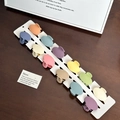 Set of 12 mini matte pastel hair claws in assorted macaron colors on a white display card - Set-17 / Random Color