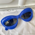 Detail view of large blue oversized cat eye sunglasses with trendy polygonal frames - Lip Shape Royal Blue Irregular