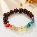 Coffee bean bead bracelet with colorful chakra gemstones on a white display stand - Coffee Bean + Chakra Tumbled Stones