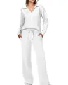 Detailed view of women's white two-piece lounge set with V-neck top and wide-leg drawstring pants - White