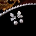 Macro detail of silver butterfly earring with cubic zirconia and round white pearl drop - Blue Butterfly Pearl Drop (Silver Pin)