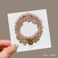 Pink crystal beaded hair tie with gold charm and 5.5cm diameter on display card - Pink Crystal Tag Scrunchie