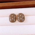Detail of brown resin oval stud earrings with white polka dots on a velvet display - 15# Silver Needle Brown Round