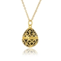 Detail of egg-shaped gold pendant with black enamel inlay and ornate cross patterns - Black