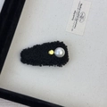 Detail of black faux lamb wool hair clip featuring a white pearl and gold metal accent - Hair Clip / Black