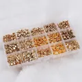 Flat lay of 15-grid DIY jewelry kit with golden beads, stars, and hearts on white fur - Combination 4