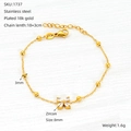 Bracelet en acier titane plaqué or 18 carats avec fleur en zircon et perles dorées - Style Fleur à Quatre Feuilles (ZH1737G)