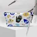 White evil eye makeup bag featuring mystic sun, moon, and Hamsa hand prints with black zipper - White Hamsa Mystic