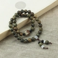 Vintage multi-layer wood bead bracelet with carved lotus bead on a linen surface - Double Circle Bracelet (1017-13#)