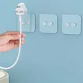 Set of 3 blue transparent plug holders with self-adhesive backing for cord management - Power Plug Hook