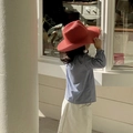 Children's wide brim red woven straw hat styled with a blue and white checkered shirt - Red