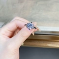 Handheld shot of 1 carat D-color Moissanite sterling silver ring in six-prong setting - US 5 / 6-Claw Round 3ct Solitaire-Silver
