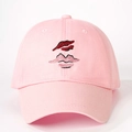 Pink cotton baseball cap with embroidered lip pattern on a white background - One Size / Light Pink