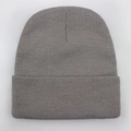 Close-up of gray knitted beanie showing fine texture and warm folded ribbed cuff detail - One Size / Gray
