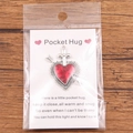 Pocket Hug heart token with red enamel and arrow design on English greeting card - Arrow Through Heart with Cross
