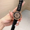 Detailed macro view of the rose gold bezel and crystal flower pattern on the black watch dial - Rose Gold Black Leather Strap