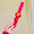 Red plush festive slap bracelet featuring a 3D lantern with Spring character and tassels - Lantern