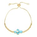 Detailed close-up of a gold double-layer cross bracelet with turquoise inlay and adjustable slider - Turquoise
