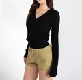 Detailed view of women's black cable-knit sweater texture with slim-fit V-neck design - S / Black